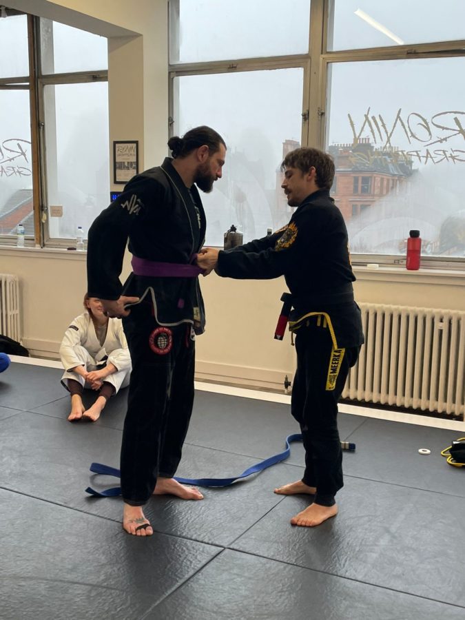 Steve Murray receiving his Purple Belt from Giles Garcia