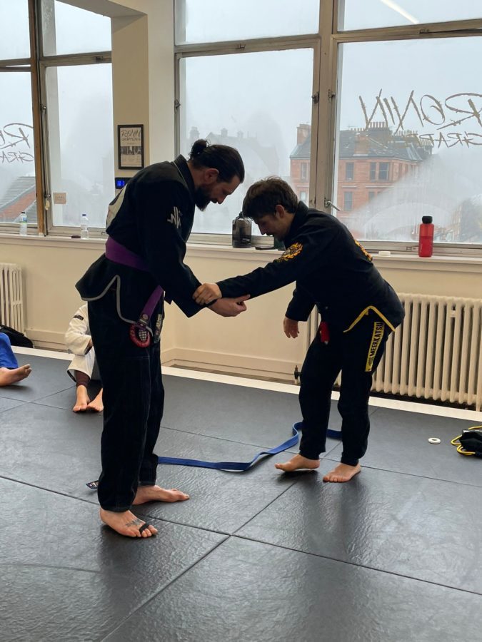 Steve Murray receiving his Purple Belt from Giles Garcia